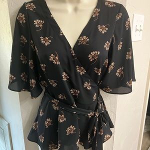 Wrap blouse with flutter sleeves, snap closure in front